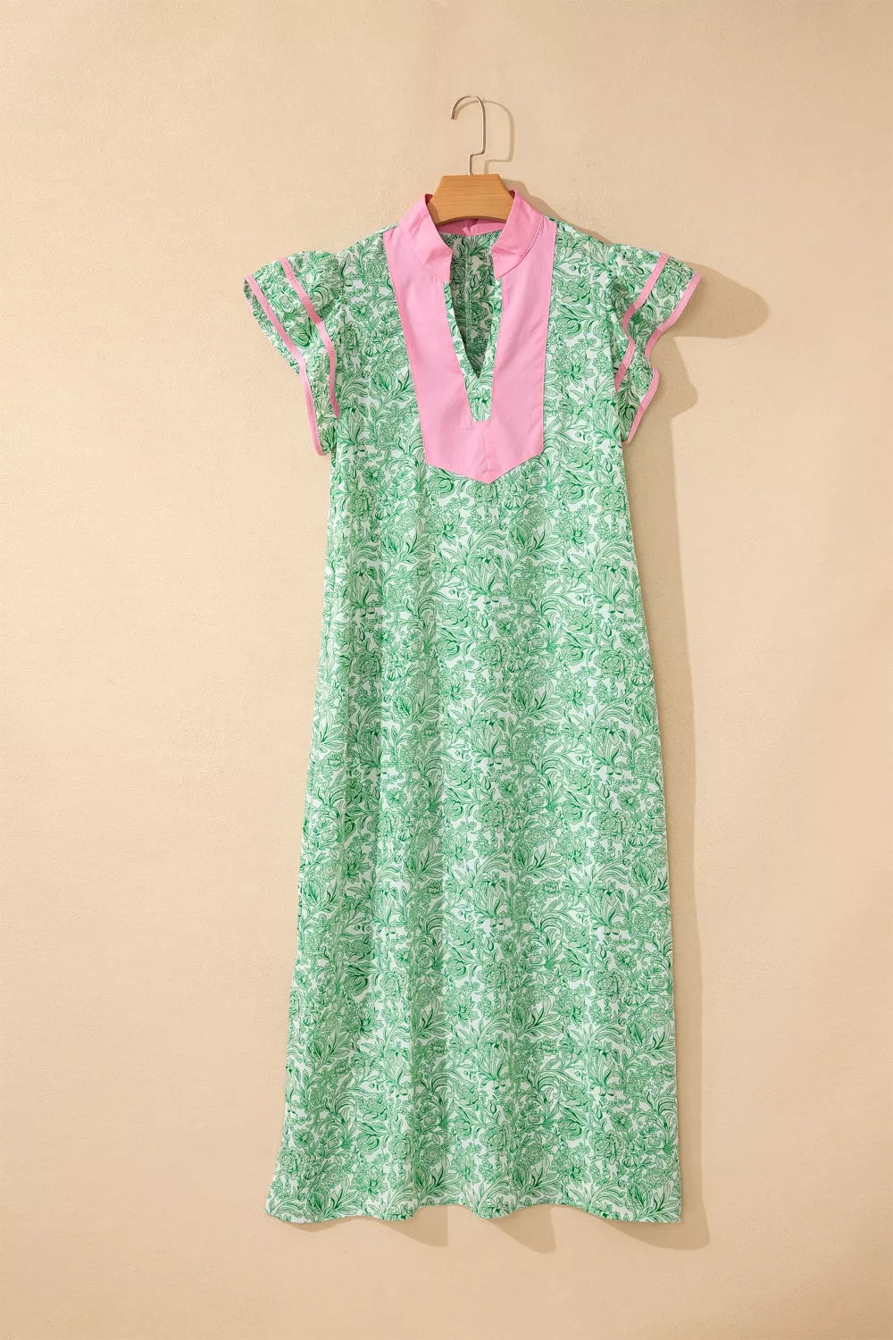 Floral midi dress with flutter sleeves and contrast trim from Trendsi, showcasing a flowy, feminine design with vibrant floral pattern.