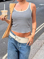 Striped scoop neck tank top by Trendsi featuring horizontal black and white stripes and a relaxed fit.