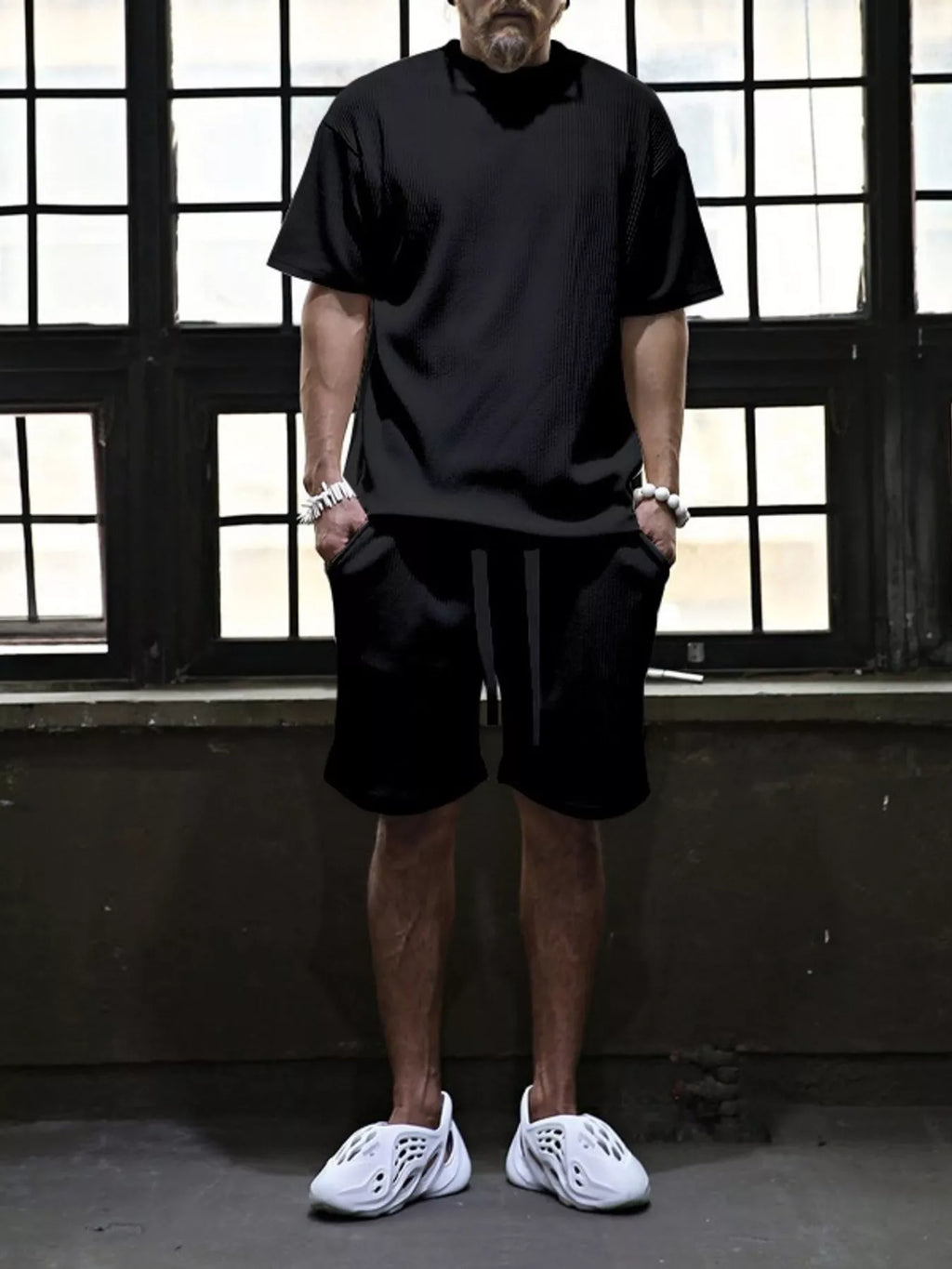 Men's plus size short sleeve top and shorts set by Trendsi, featuring a coordinated casual outfit in comfortable fabric.