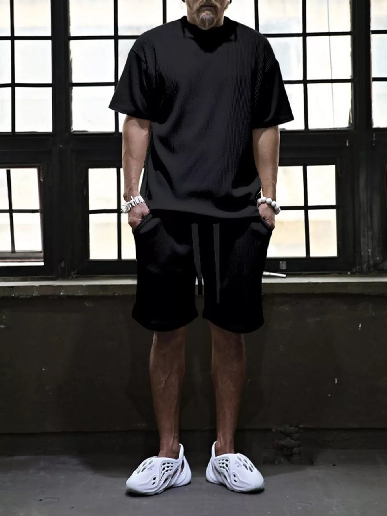 Men's plus size short sleeve top and shorts set by Trendsi, featuring a coordinated casual outfit in comfortable fabric.