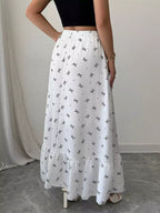Bowknot print ruffle hem maxi skirt from Trendsi, featuring a flowy design with a bowknot pattern and ruffled hem detail.