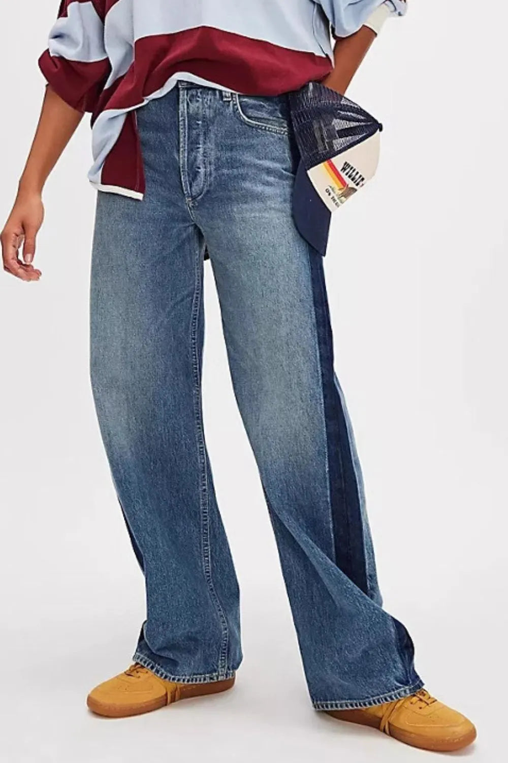 Plush Fashion Hub baggy denim jeans with large front and back pockets, relaxed fit, casual style, and classic blue denim color.