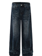 Men's washed wide-leg jeans from Trendsi, showcasing relaxed fit and distressed denim fabric with a casual style.