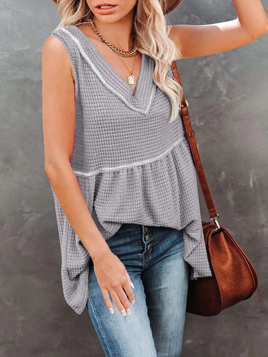 V-neck waffle knit tank top with contrast stitching, casual sleeveless top from Trendsi, featuring a textured fabric and relaxed fit.
