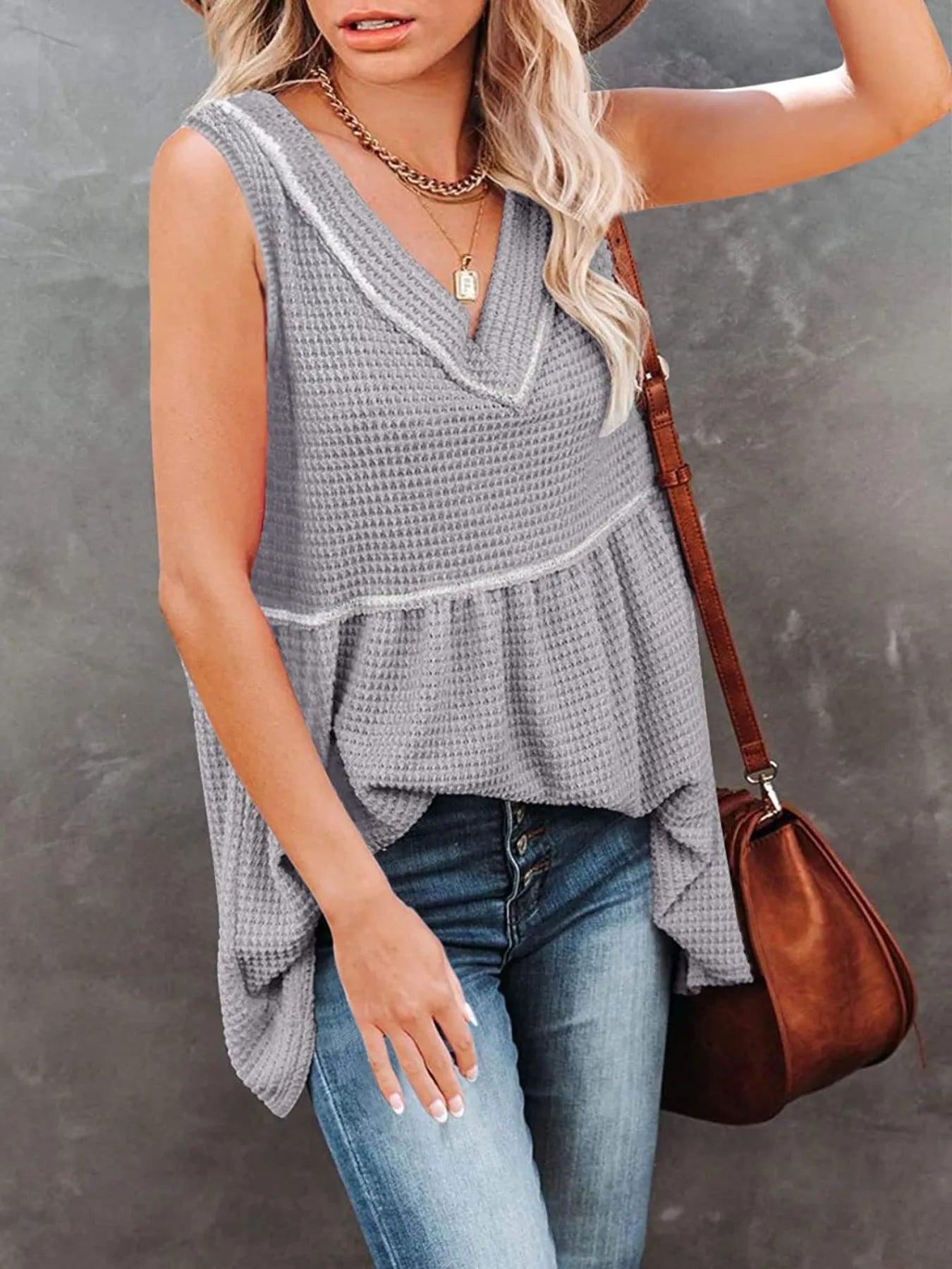 V-neck waffle knit tank top with contrast stitching, casual sleeveless top from Trendsi, featuring a textured fabric and relaxed fit.