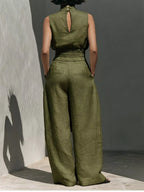 Sleeveless turtleneck top and wide-leg pants set by Trendsi, featuring a stylish, coordinated outfit with neutral tones.