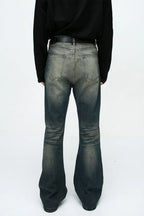 Plush Fashion Shop denim bootcut jeans with front and back pockets, fitted waist, and classic blue denim fabric.