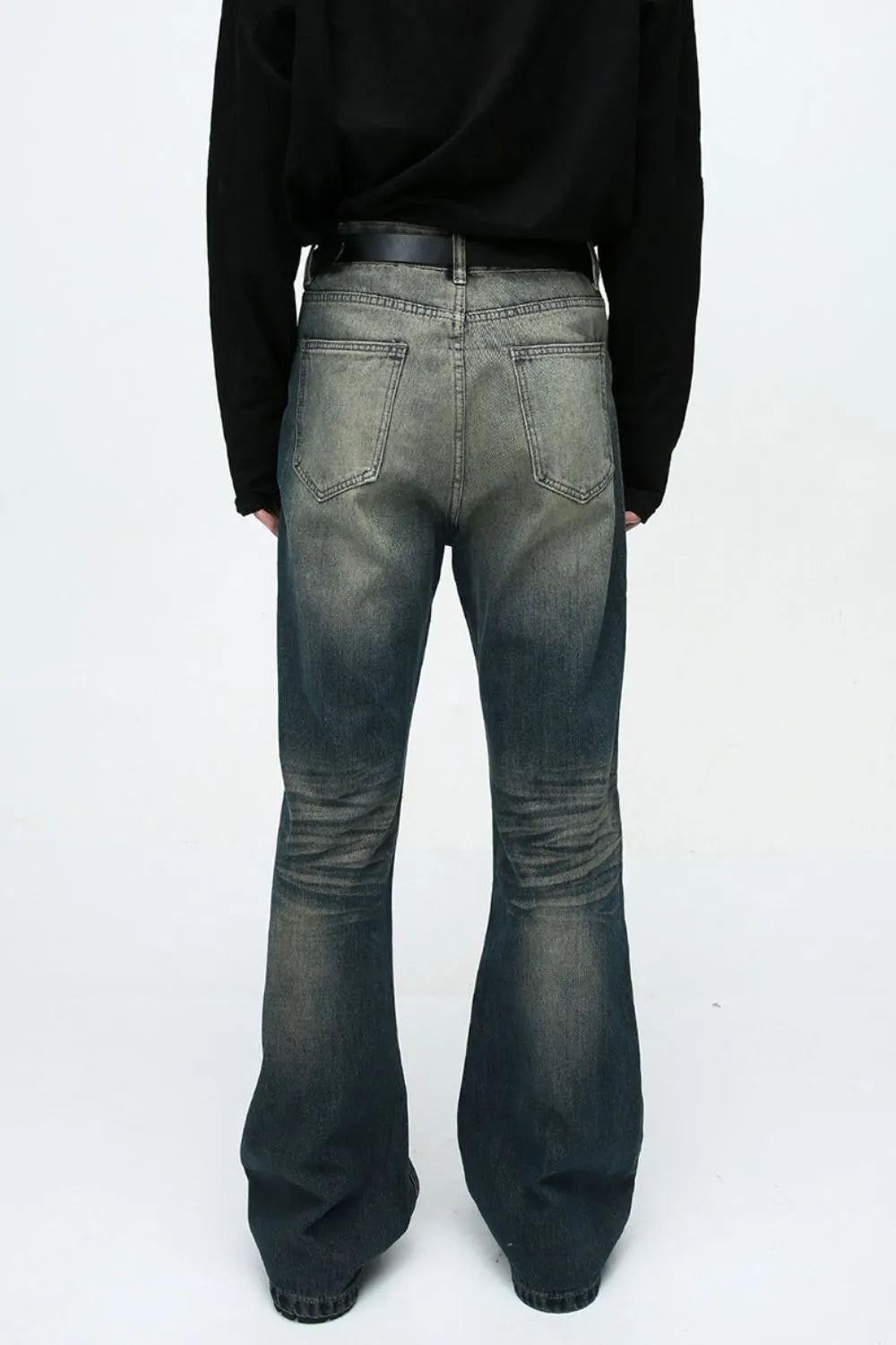 Plush Fashion Shop denim bootcut jeans with front and back pockets, fitted waist, and classic blue denim fabric.