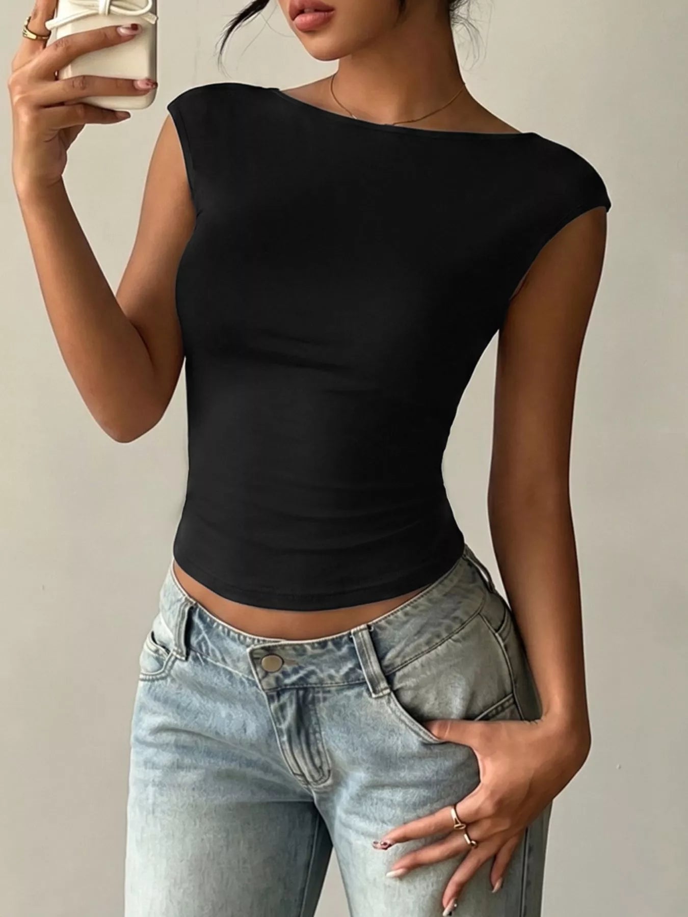 Lace detail cap-sleeve T-shirt by Trendsi, showing soft fabric with delicate lace accents on the sleeves and neckline.