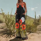 Black wide-leg jumpsuit with orange poppy flowers, moon, star pattern, and deep side pockets.
