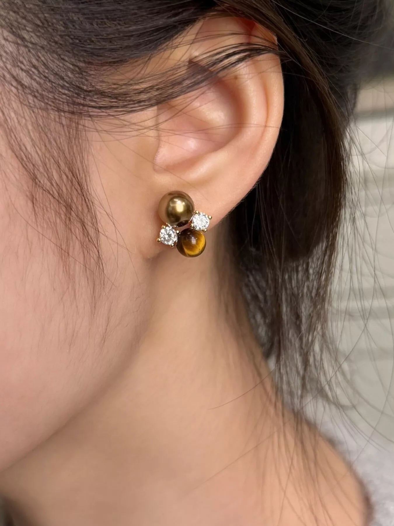 Tiger Eye stud earrings by Trendsi featuring polished gemstone studs with a warm, golden-brown hue and sleek metal posts