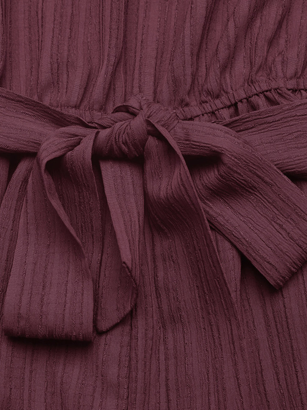 Elegant one-shoulder tie-waist romper in premium polyester, perfect for summer, shown in a stylish jumpsuit design.