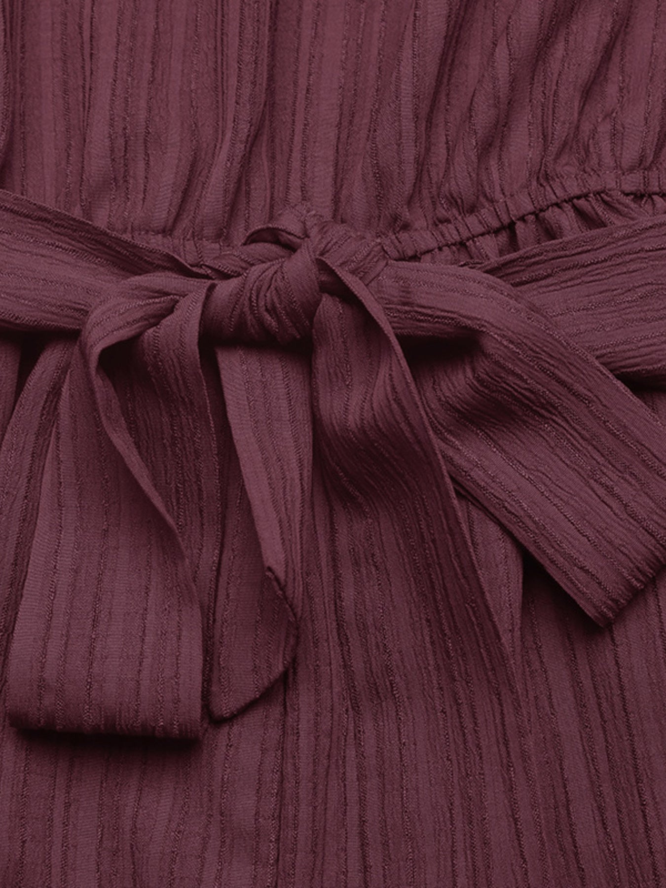 Elegant one-shoulder tie-waist romper in premium polyester, perfect for summer, shown in a stylish jumpsuit design.