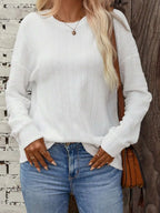 Textured round neck long sleeve T-shirt from Trendsi, showcasing its soft fabric and stylish design in a close-up view.