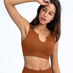 Women's seamless ribbed built-in bra tank top from Plush Fashion Hub, longline workout crop top, ideal for activewear and exercise.