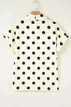 Polka dot print high neck dolman top from Trendsi, featuring a relaxed fit and stylish design, displayed on a hanger.