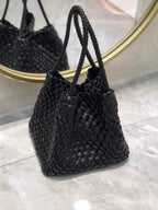 Hand-pressed woven tote bag from Plush Fashion Hub with sturdy handles and intricate woven design, perfect for casual outings.