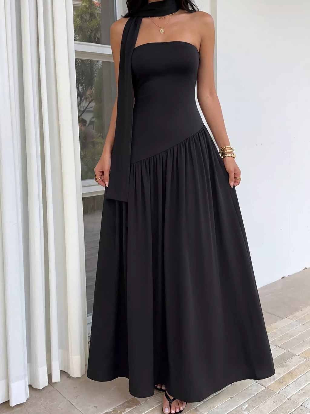 Maxi dress with slit and scarf detail by Trendsi, featuring flowing fabric and stylish design for elegant summer wear.