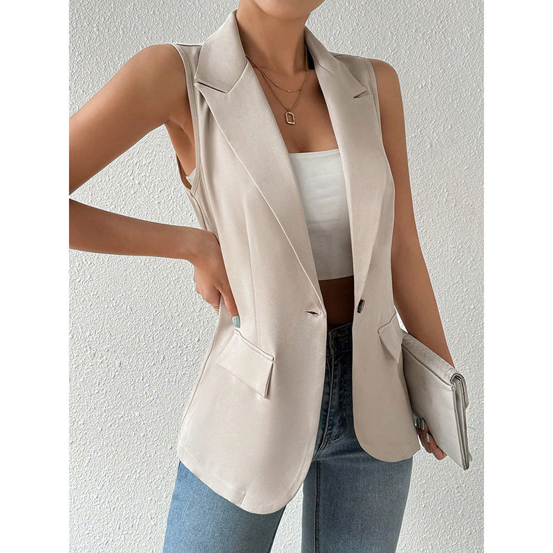 A beige sleeveless tailored blazer with lapels, a single button closure, and side flap pockets.