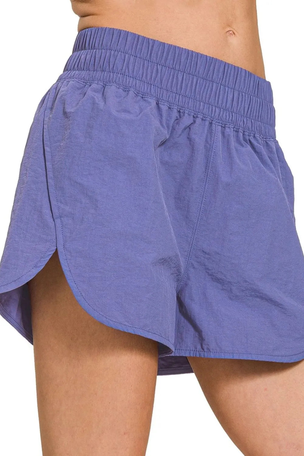 Zenana active wear windbreaker running shorts with smocked waistband, lightweight fabric, and sporty design for outdoor activities.