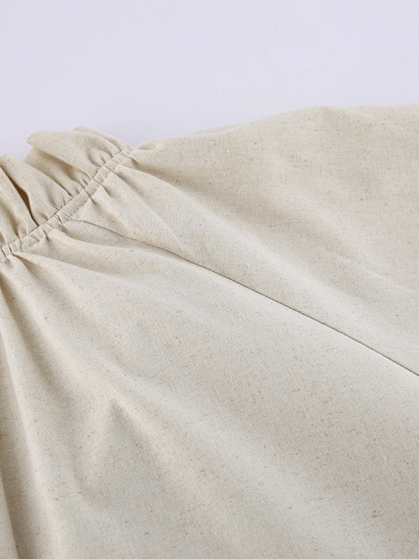 Cotton linen maxi dress with tie neck and flounce sleeves, trendy dress from Trendsi featuring a flowing silhouette and relaxed fit.