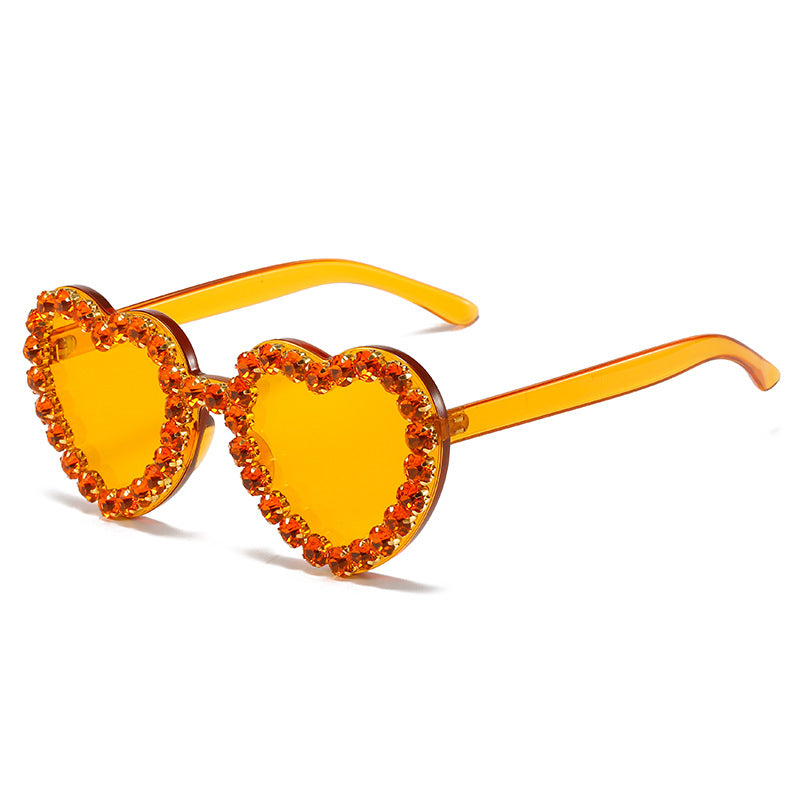 Peach heart-shaped rhinestone sunglasses by FitiqueFit, Y2K INS style, featuring bold frames and sparkling rhinestone details.