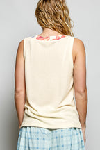 Ribbed V-neck tank top with contrast floral neckband, trendy sleeveless design, by Trendsi, close-up of fabric and detailed neckline.