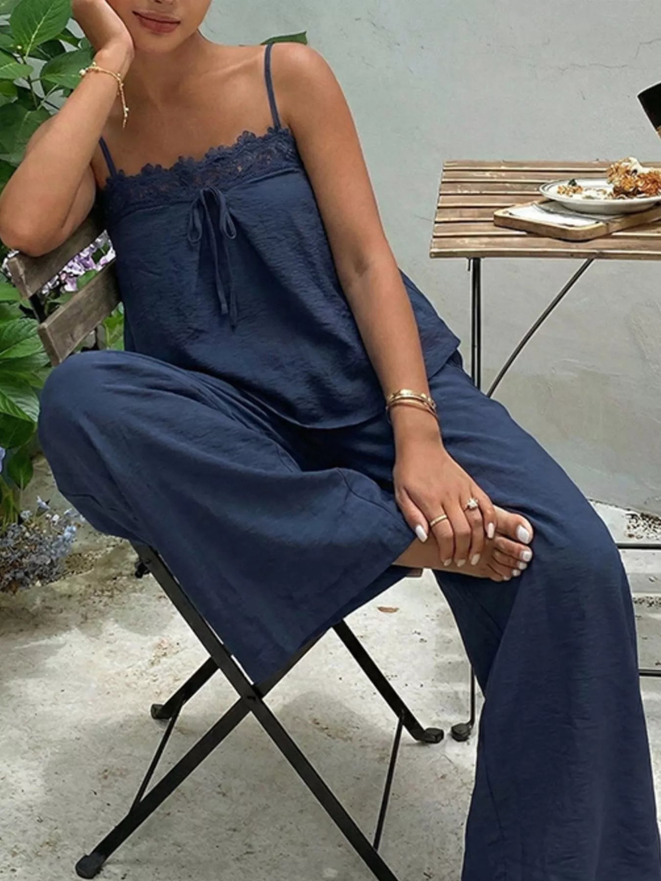 Lace trim cami and wide-leg pants set by Trendsi, featuring a stylish camisole with lace details and flowy wide-leg trousers.