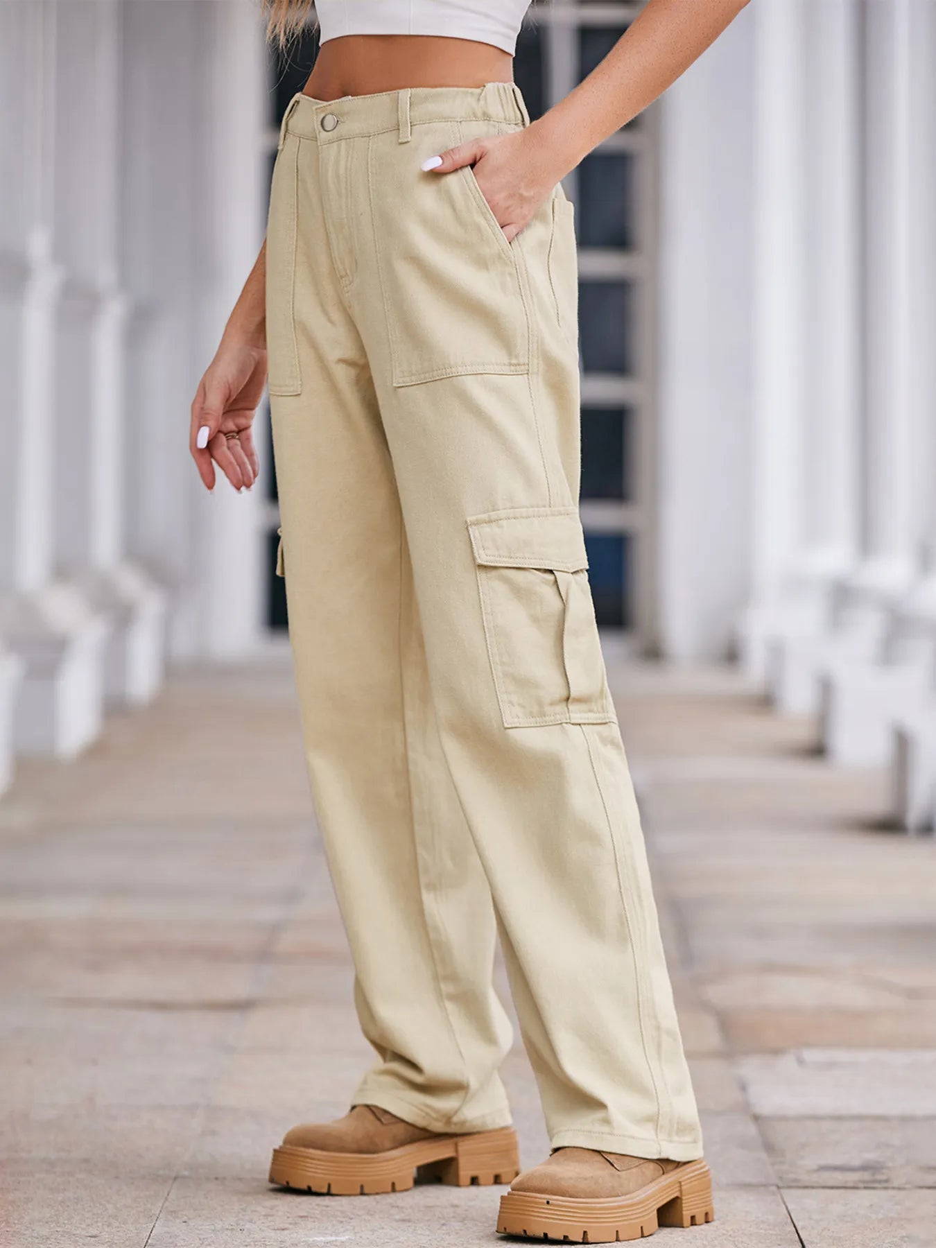 High-waisted cargo denim jeans from Plush Fashion Shop, showing front view with functional side pockets and relaxed fit.