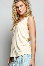Ribbed V-neck tank top with contrast floral neckband, trendy sleeveless top from Trendsi, showing the detailed floral trim.
