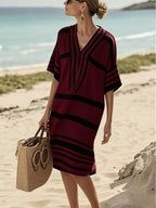 Plus size women's striped half-sleeve midi dress by Trendsi, casual chic everyday wear with a stylish, comfortable fit.