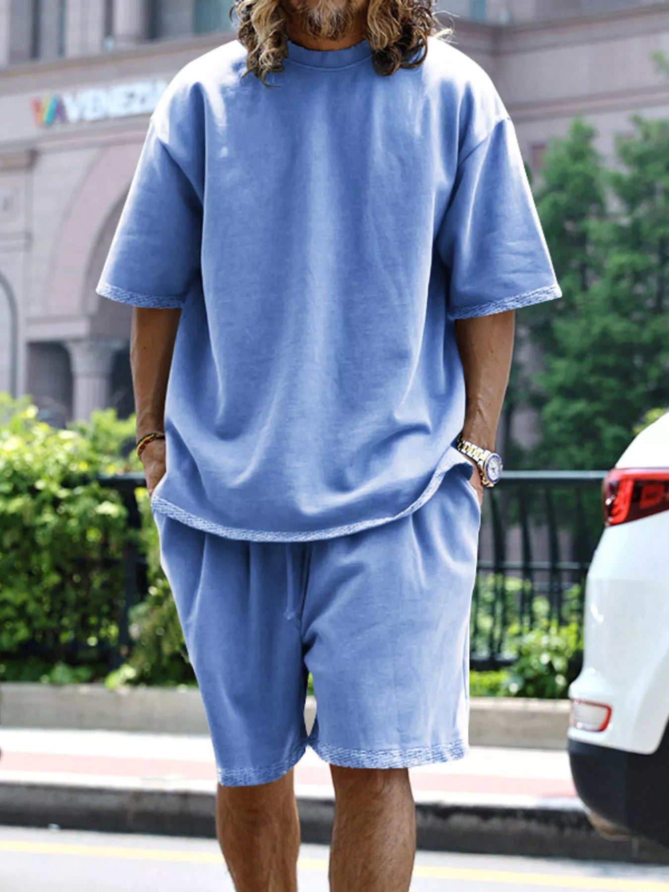 Men's relaxed fit T-shirt and shorts set in plus size by Trendsi, casual loungewear with comfortable fabric and relaxed style.