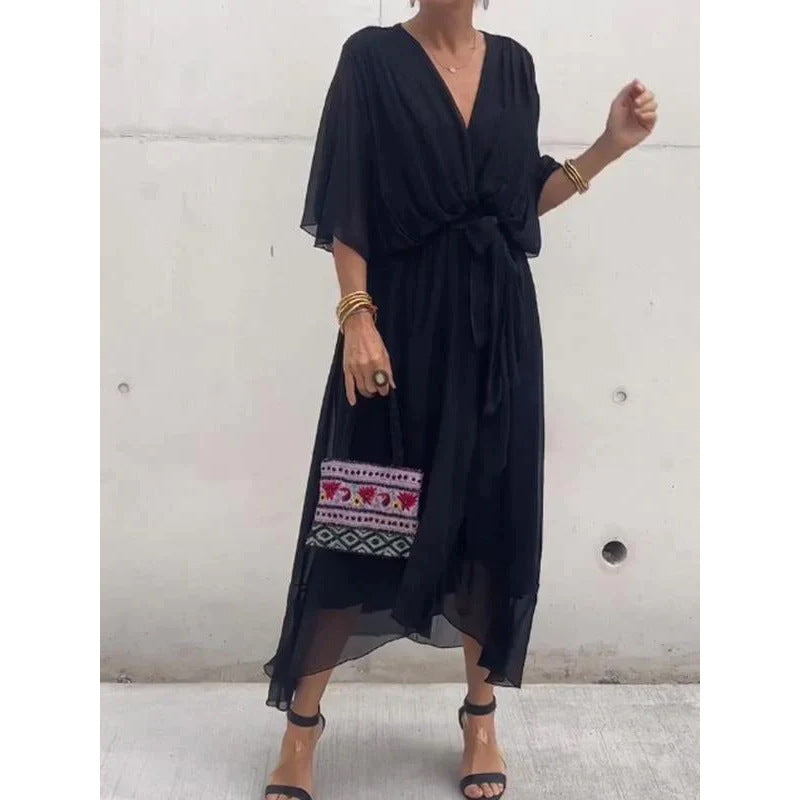 Plush Fashion Hub batwing sleeve V-neck midi dress with tied irregular hem, flowing fairy dress style in soft fabric.