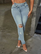 Distressed Plush Fashion Shop denim skinny jeans with ripped details and a fitted style, shown on a model.