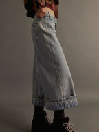 Light blue plush fashion shop denim wide-leg cropped jeans displayed on a hanger with visible stitching and relaxed fit.