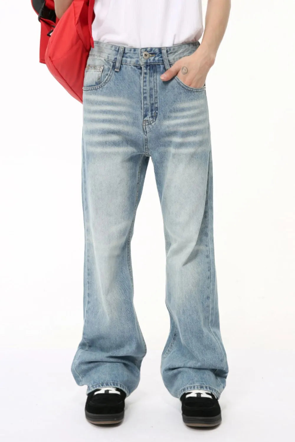 Plush Fashion Hub baggy denim jeans with multiple pockets, relaxed fit, and classic blue wash, shown on a model.