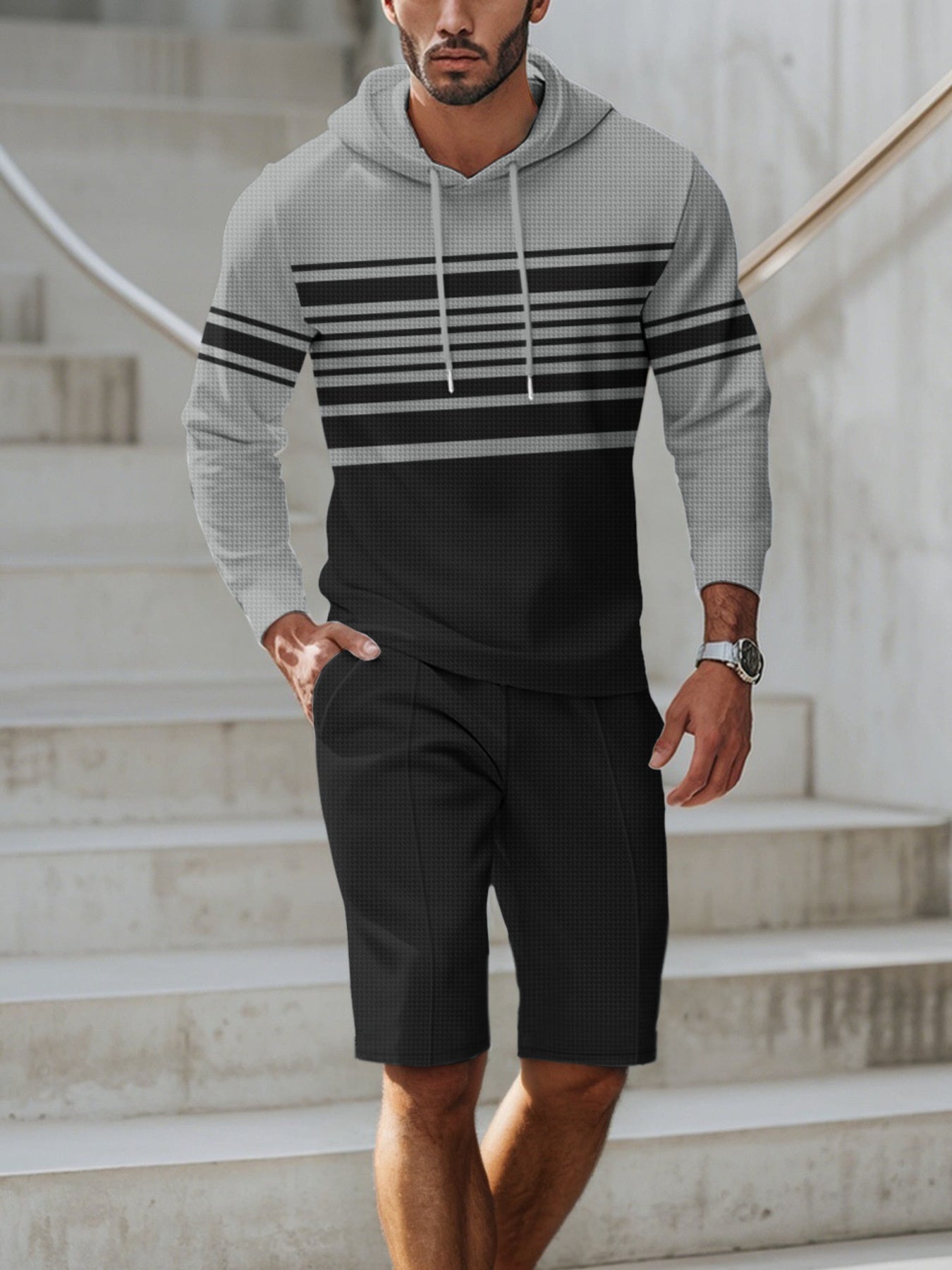 Men's full size striped hoodie and shorts casual set by Trendsi, featuring a comfortable hoodie and matching shorts in a stylish striped pattern.