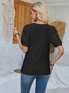 Asymmetrical neck short sleeve T-shirt with eyelet details, trendy Tops by Trendsi featuring stylish design and comfortable fit.