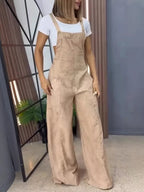 Full size wide leg denim overalls from Trendsi, featuring a one-piece design with adjustable straps and chest pockets.