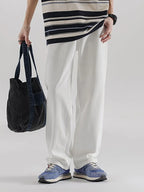 Men's wide leg denim jeans by Plush Fashion Shop, showing the relaxed fit and classic denim texture.