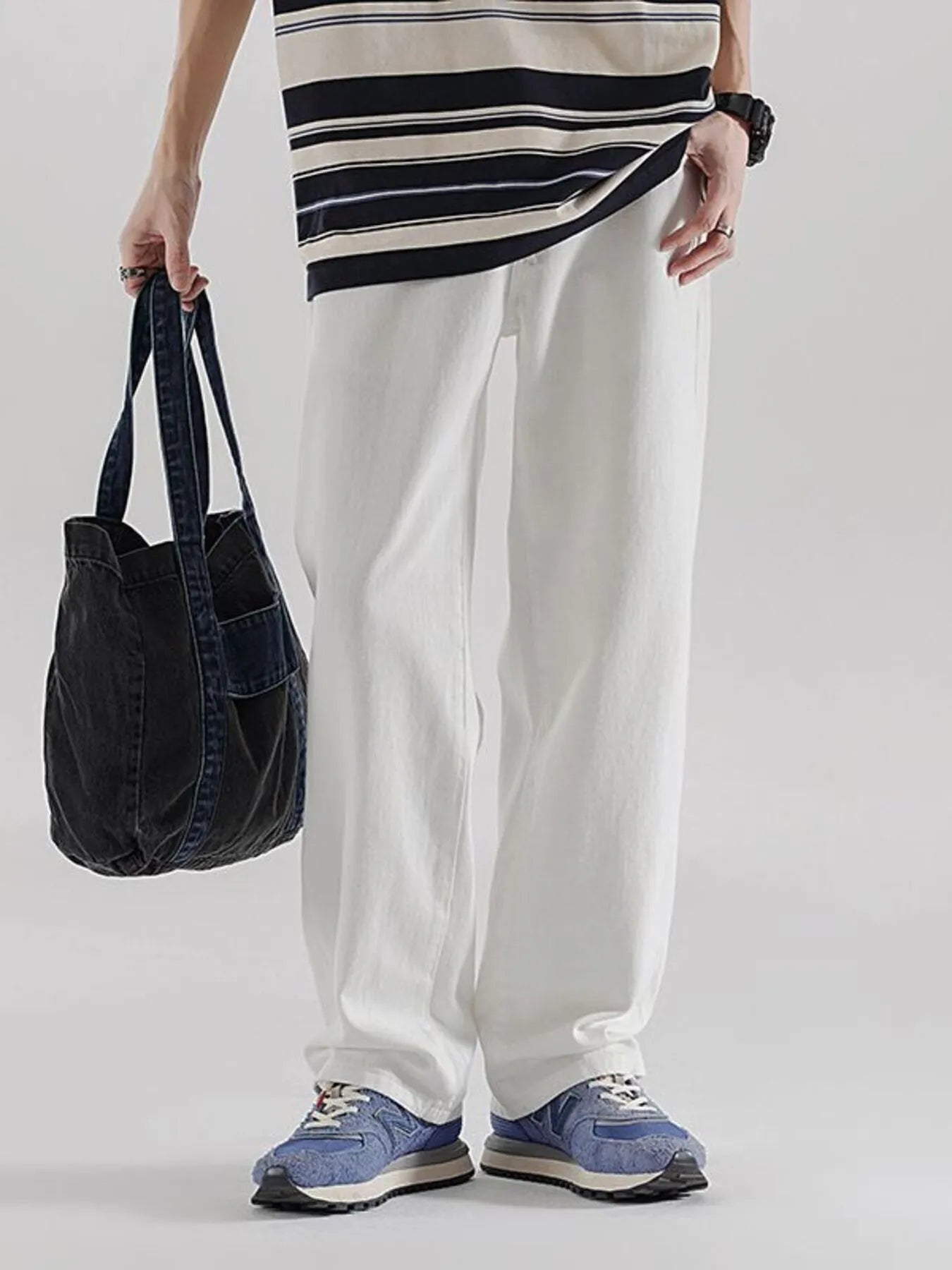 Men's wide leg denim jeans by Plush Fashion Shop, showing the relaxed fit and classic denim texture.