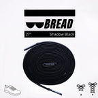 Black elastic shoelace by Bread, designed for easy slip-on shoes, shown in a classic style with a sleek, shadow black finish.