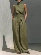 Sleeveless turtleneck top and wide-leg pants set by Trendsi, shown in a stylish, coordinated outfit with a modern silhouette.