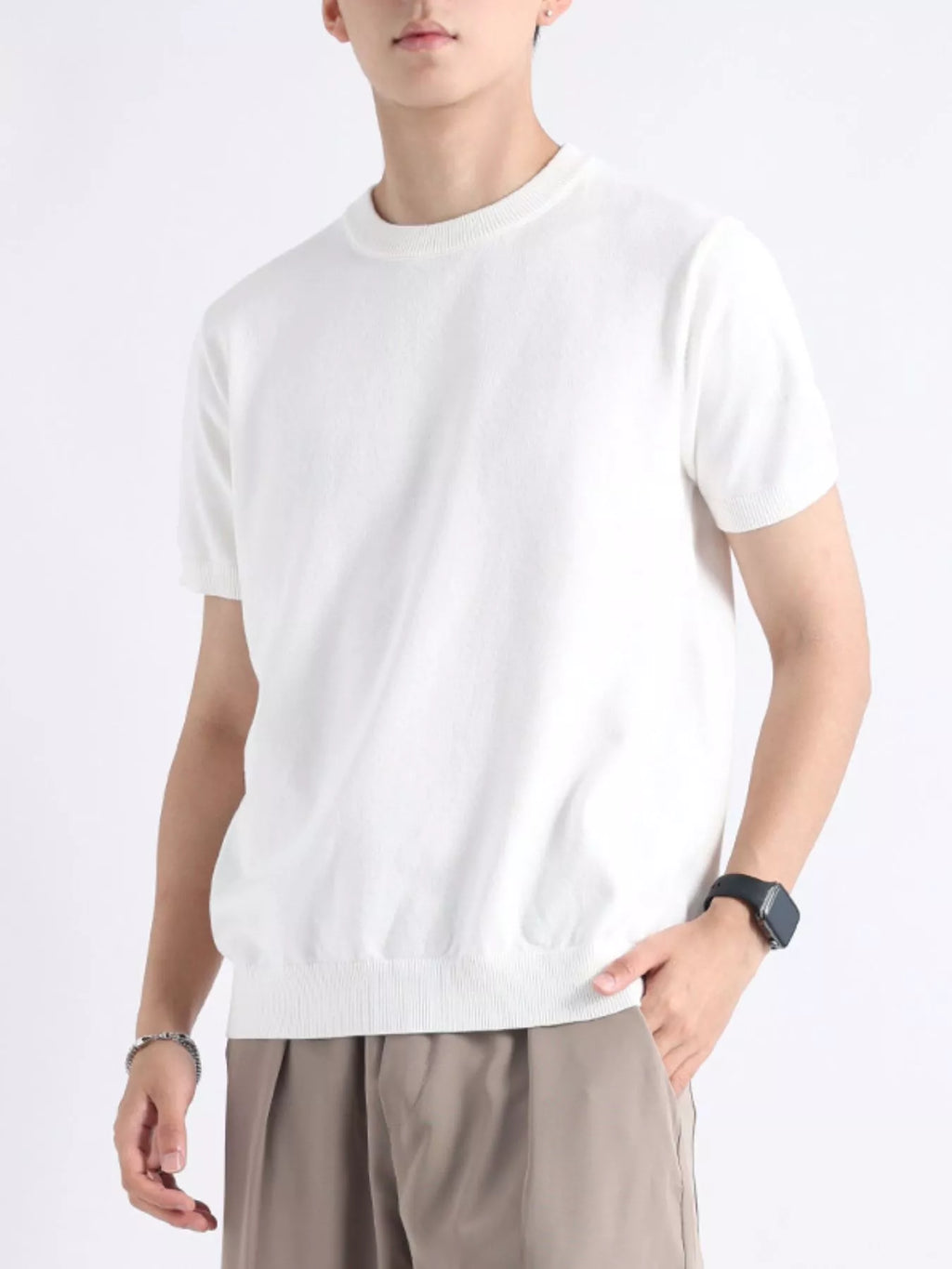Plus size men's casual knitted short sleeve T-shirt by Trendsi, featuring a comfortable fit and soft knit fabric.