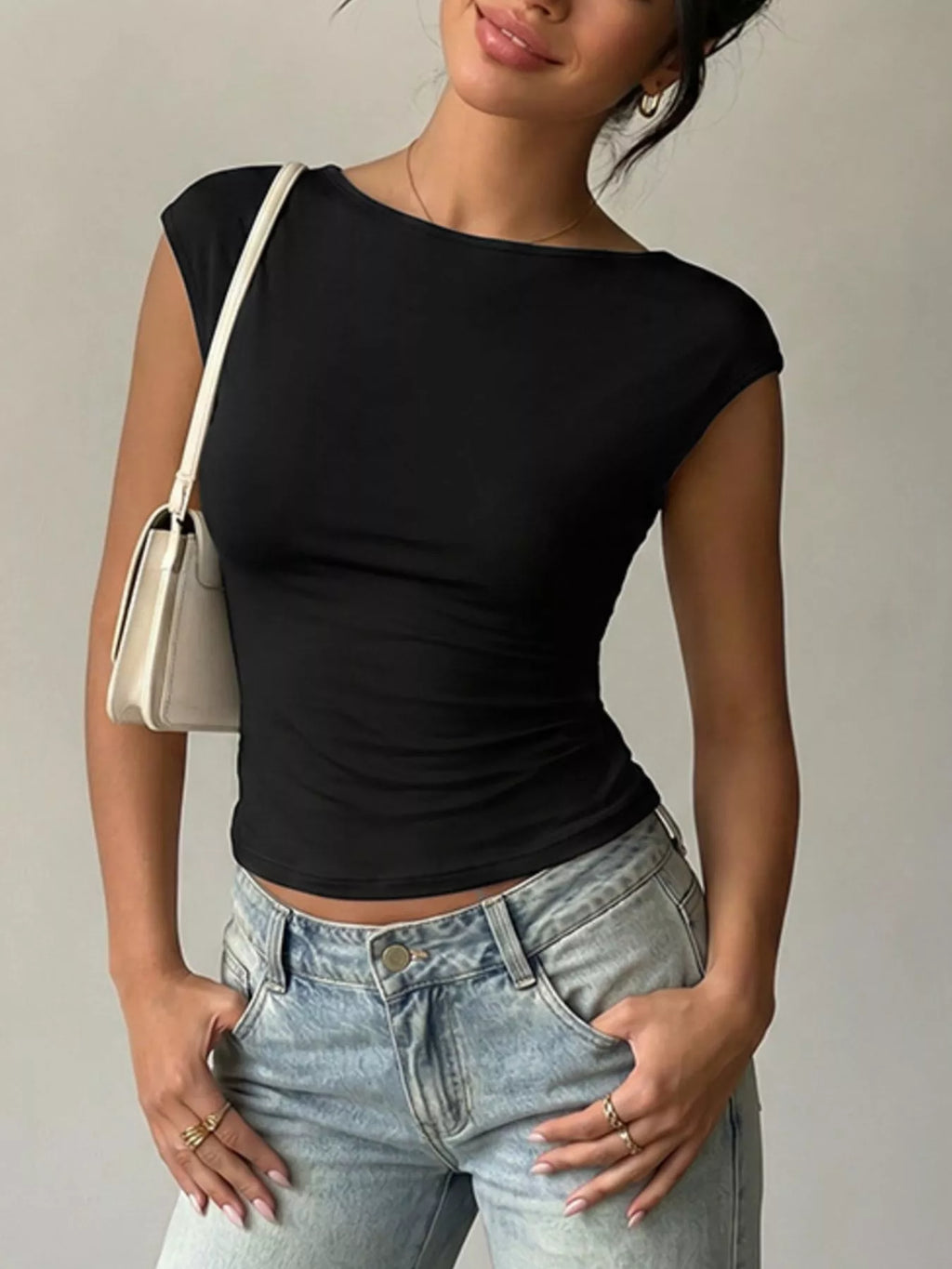 Lace detail cap-sleeve T-shirt by Trendsi, featuring soft fabric and elegant lace accents on the sleeves and neckline.