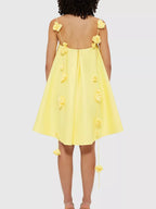 Floral strap mini A-line dress by Trendsi featuring a fitted bodice, flared skirt, and vibrant flower pattern.