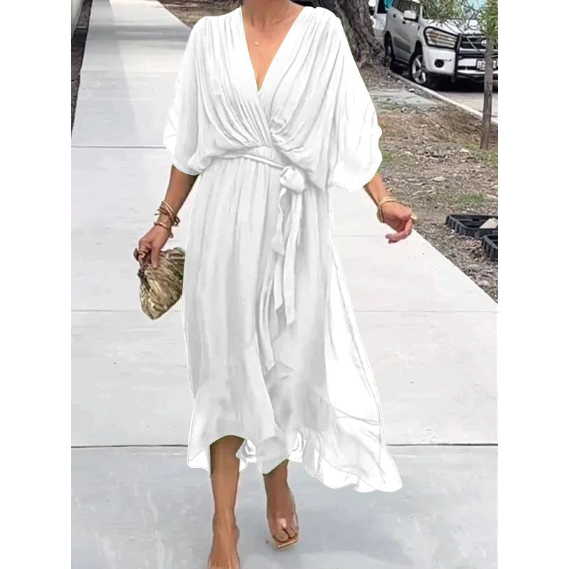 Batwing sleeve V-neck midi dress with tied irregular hem from Plush Fashion Hub, featuring a flowing, fairy-style silhouette.