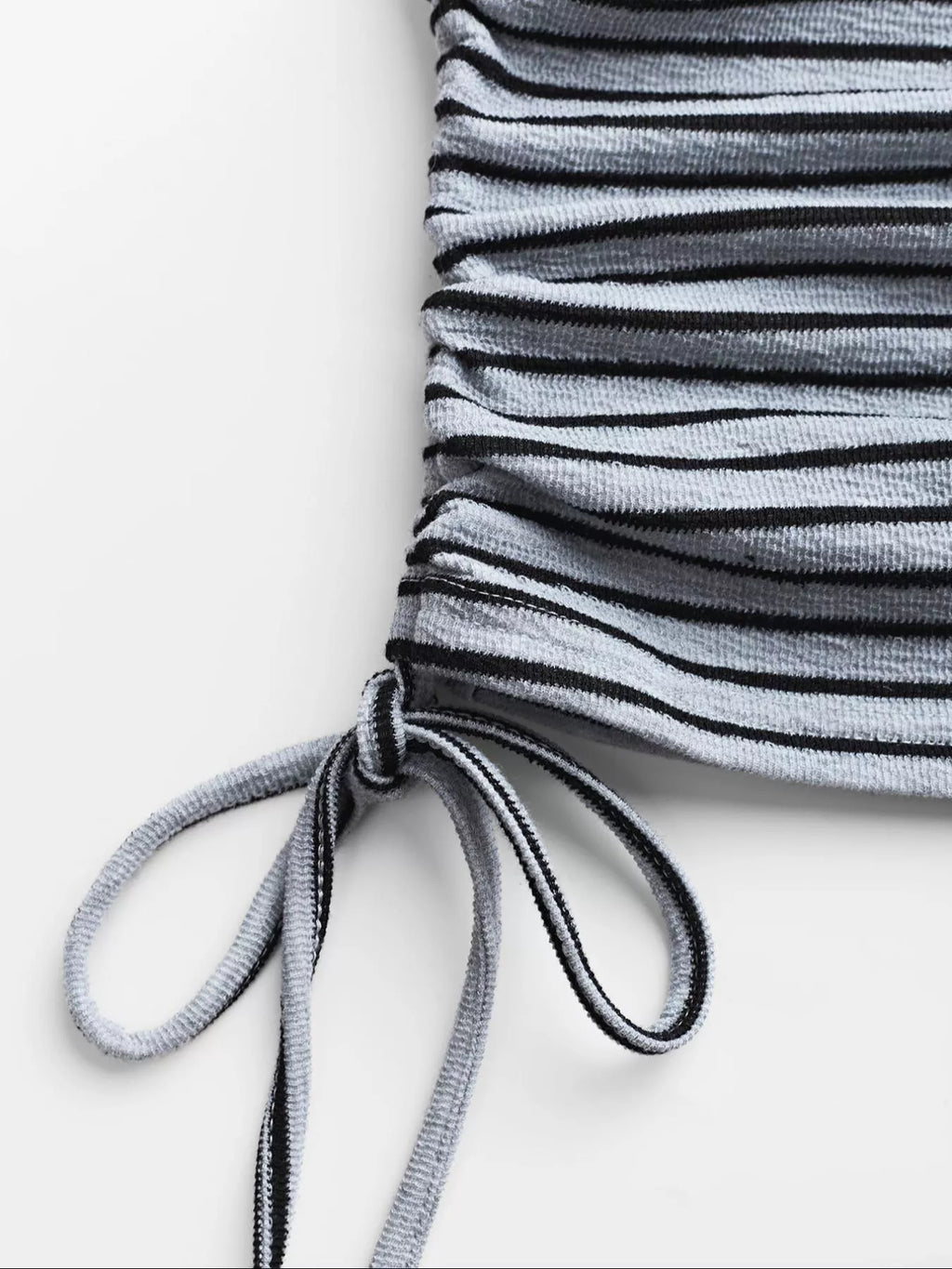 Striped crop top and wide-leg pants set by Trendsi, featuring a stylish matching dress with bold horizontal stripes.
