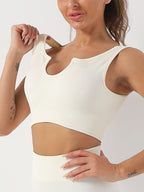 Women's seamless ribbed built-in bra tank top by Plush Fashion Hub, longline workout crop top with ribbed texture and activewear style.