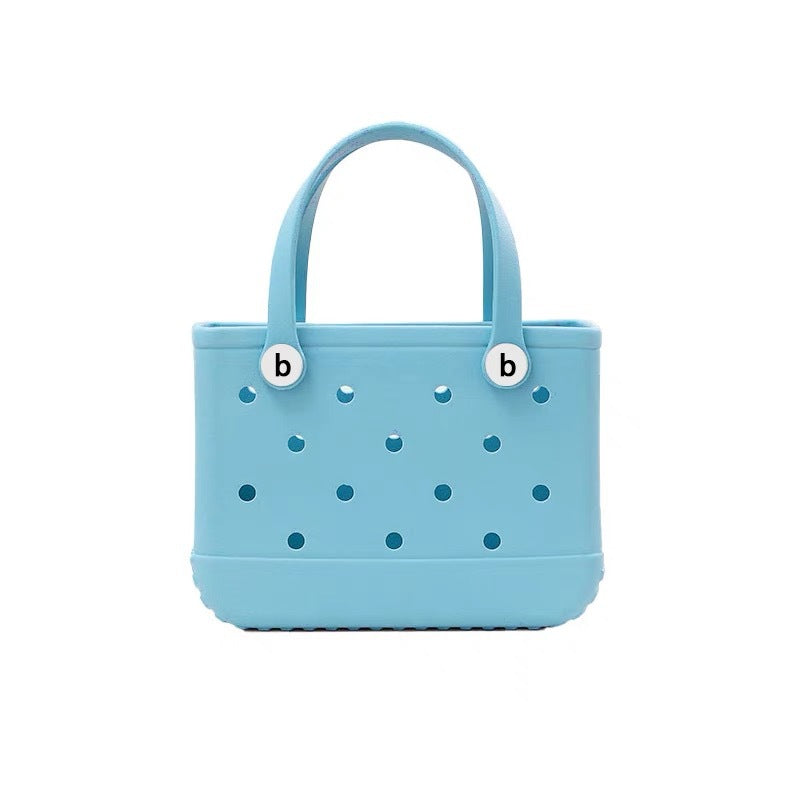 Women's waterproof EVA jelly beach bag from Plush Fashion Hub, lightweight summer tote with clear, flexible jelly material and handles.